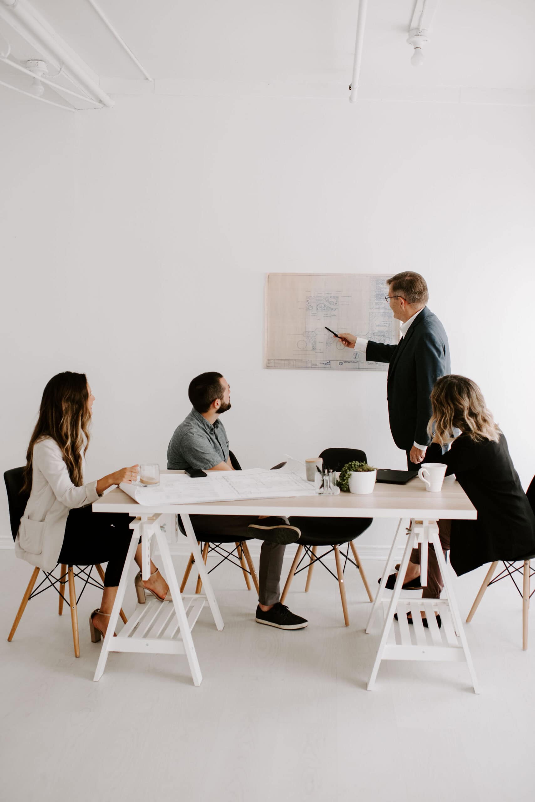 Business team discussing competition strategies in a modern office.
