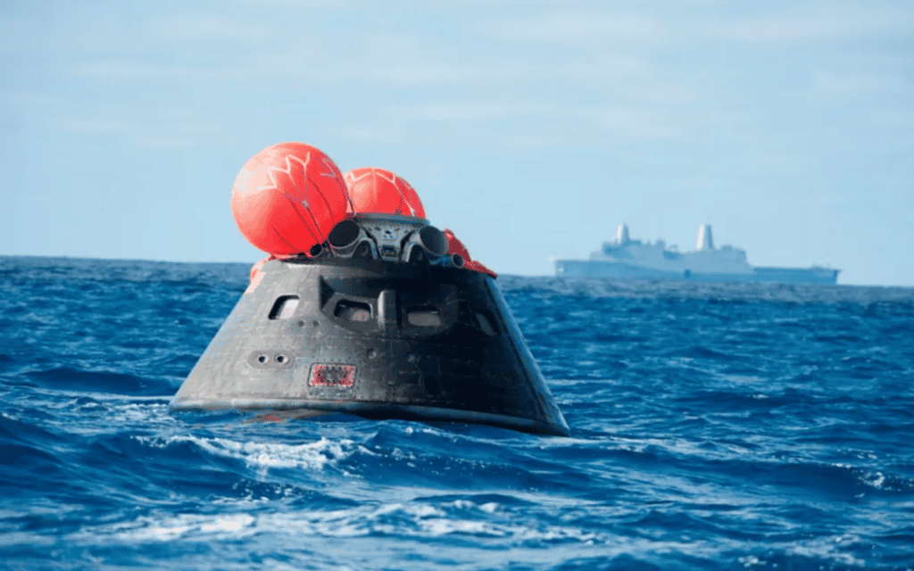 Deep-sea submarine with red balloons in open water.