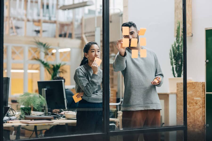 Team discussing office space options in a modern coworking environment.