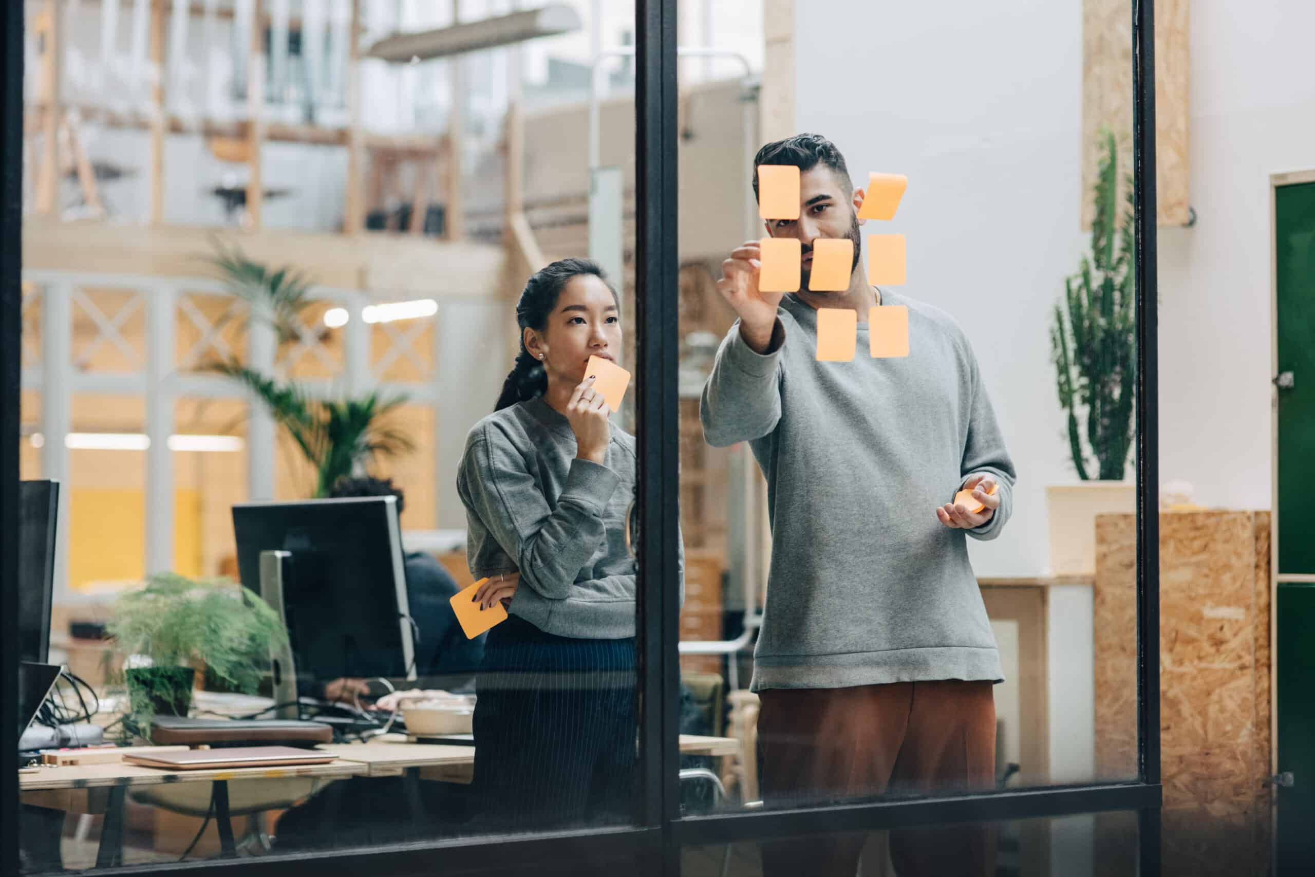 Team discussing office space options in a modern coworking environment.