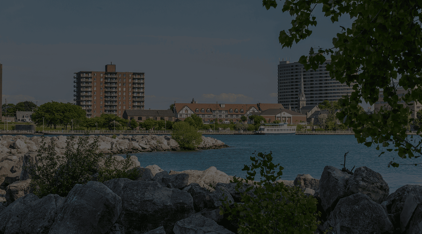 City skyline with river and trees, urban landscape for The Focal Point Group.