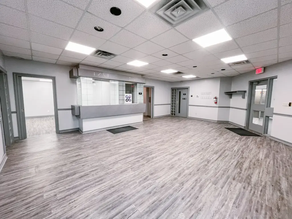 Open reception area with glass-block partition and windows in Suite 106B at 353 St. Paul Avenue, Brantford.