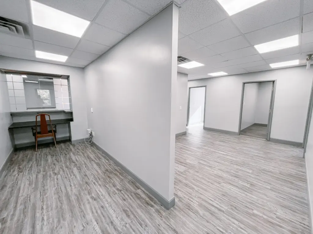 Private room with countertop and adjoining open office area in Suite 106B at 353 St. Paul Avenue, Brantford.