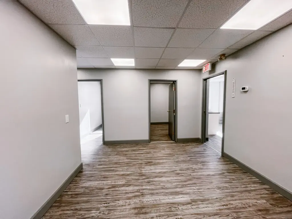 Interior corridor connecting private rooms in Suite 106B at 353 St. Paul Avenue, Brantford.