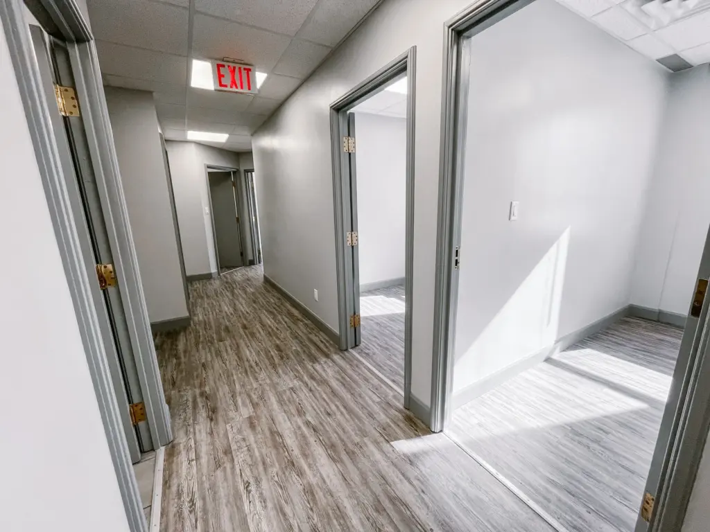 Hallway and entrances to private rooms in Suite 106B at 353 St. Paul Avenue, Brantford.