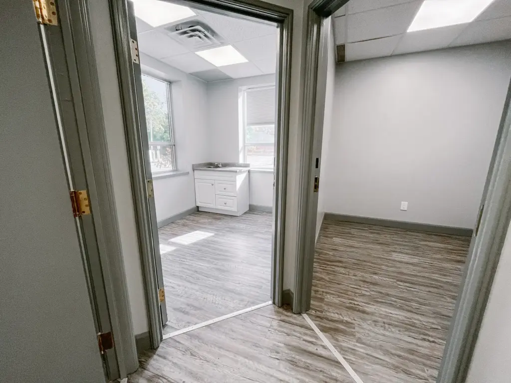 Adjoining private rooms, including a room with cabinetry in Suite 106B at 353 St. Paul Avenue, Brantford.