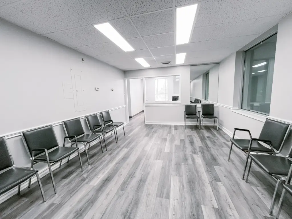 Waiting area with reception window and exterior windows in Suite 205A at 353 St. Paul Avenue, Brantford.