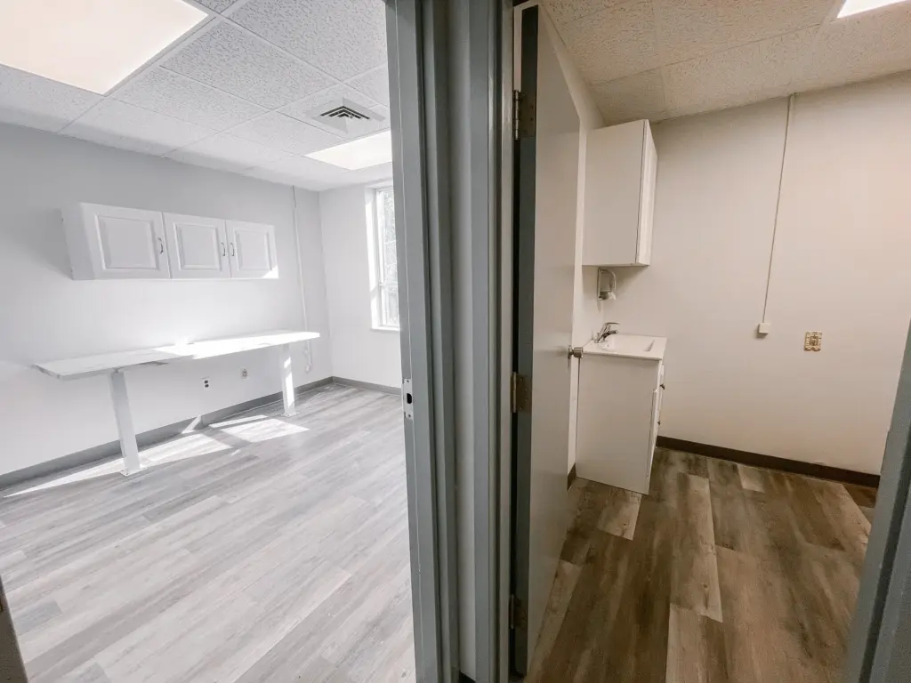 Private clinical room and adjacent room with sink cabinetry in Suite 205A at 353 St. Paul Avenue, Brantford.
