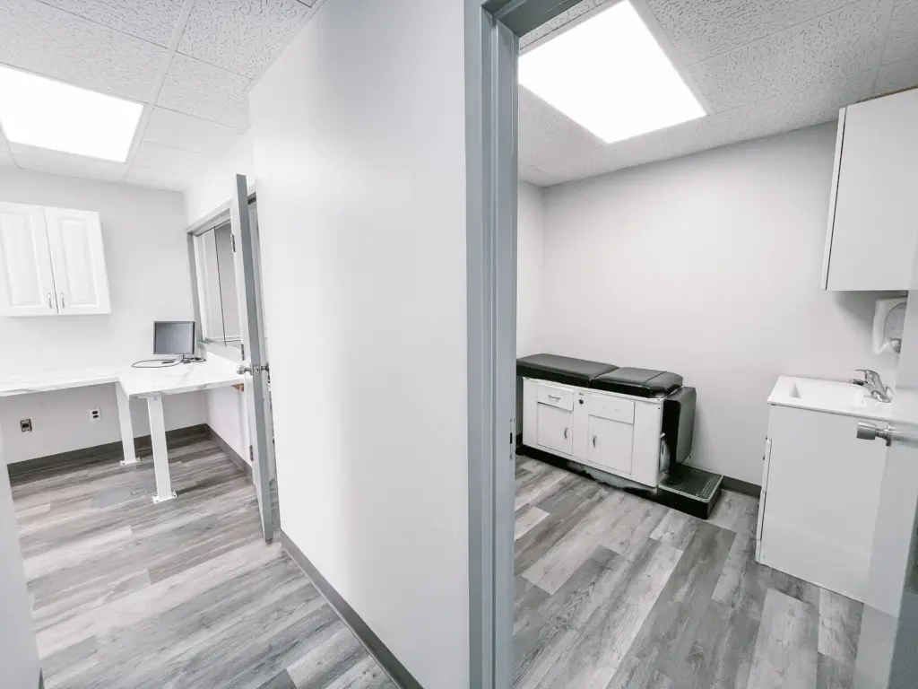 Adjoining clinical rooms with cabinetry and sinks in Suite 205A at 353 St. Paul Avenue, Brantford.